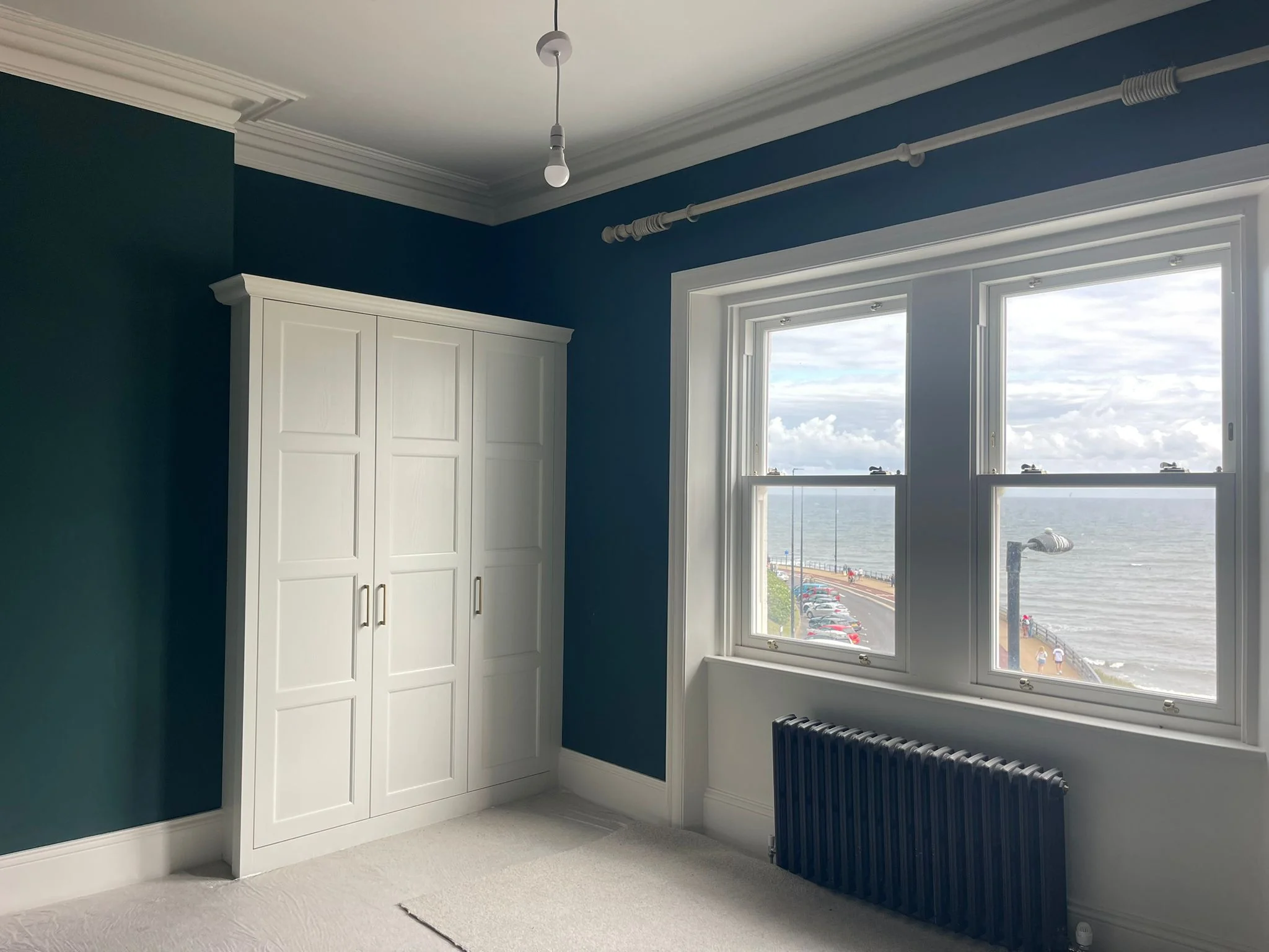 Bedroom walls painted blue in Newcastle by Tulip Decor