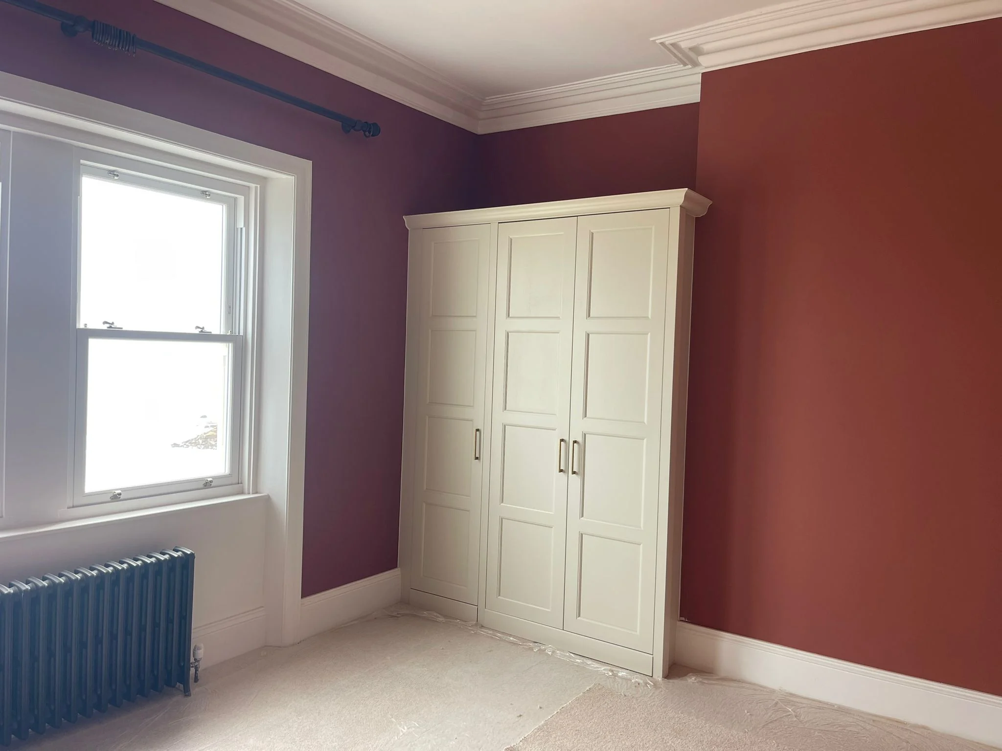 Bedroom walls painted purple and terracotta in Newcastle by Tulip Decor