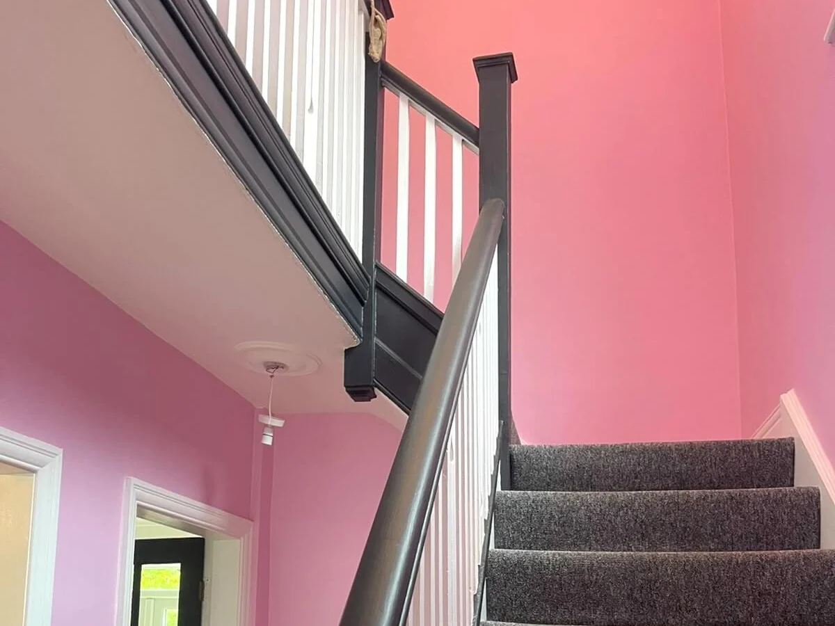 Hallway and staircase walls painted pink in Newcastle by Tulip Decor