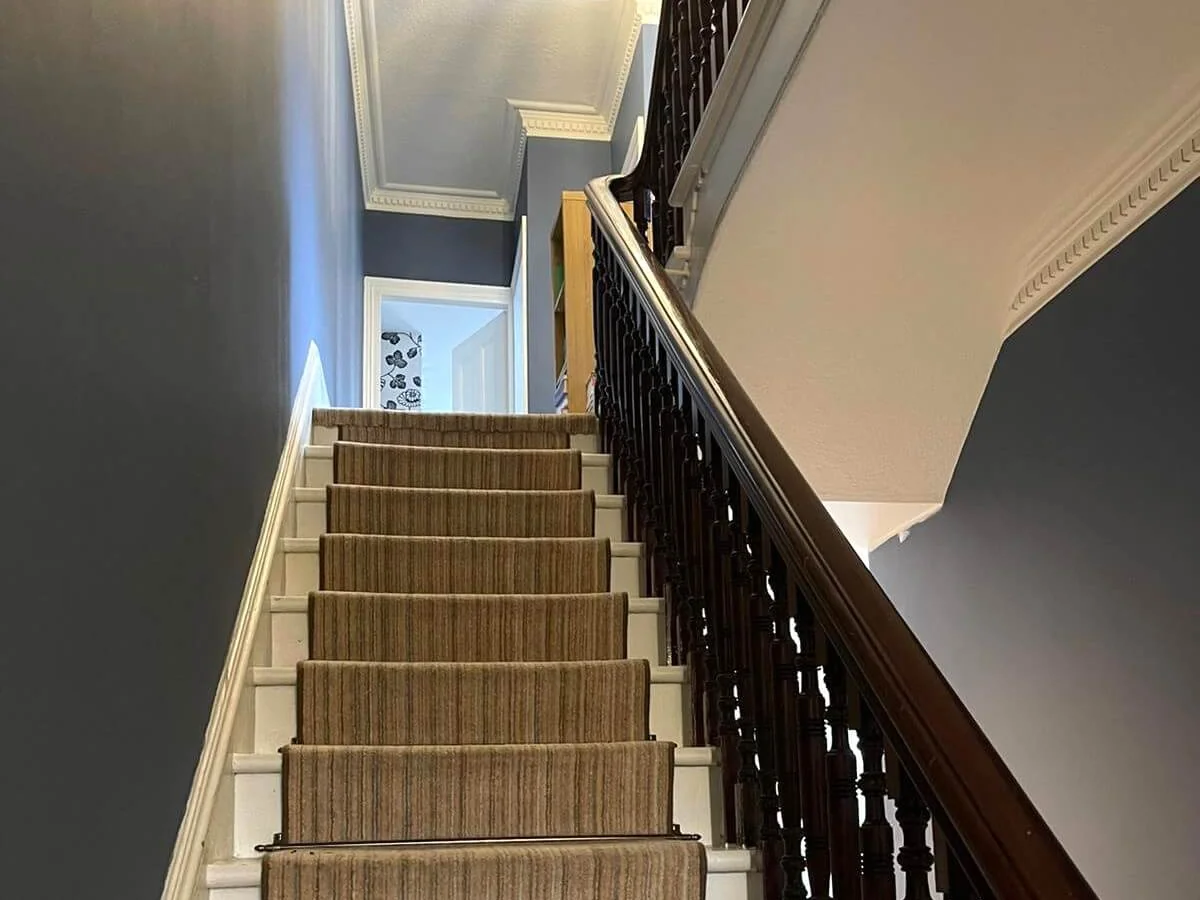 Staircase before painting in Newcastle, showing condition requiring strip and repaint