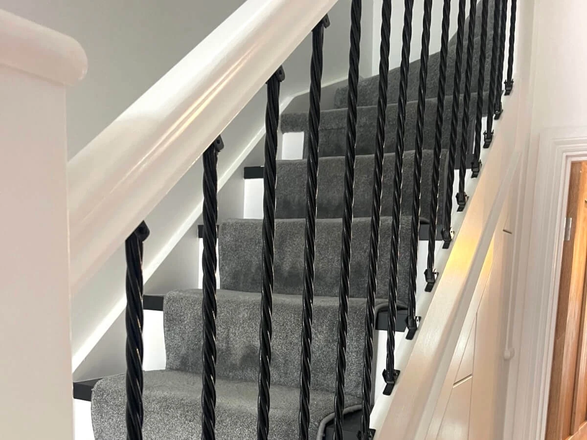 Staircase spindles and handrail painted in Newcastle by Tulip Decor